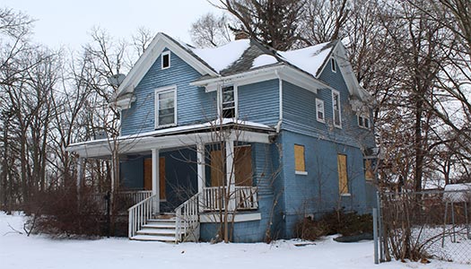 Blue house in snow
